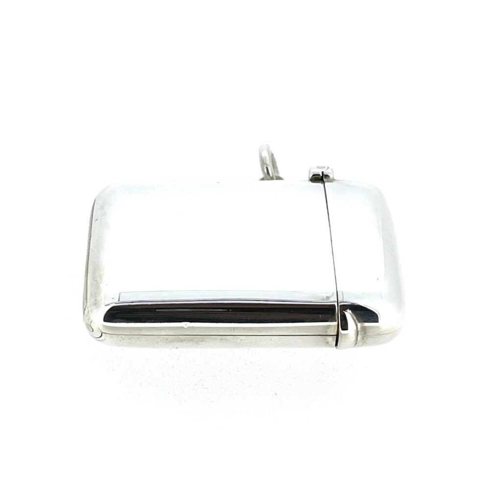 Close view of the sprung lid and hinge on the Sampson Mordan vesta case