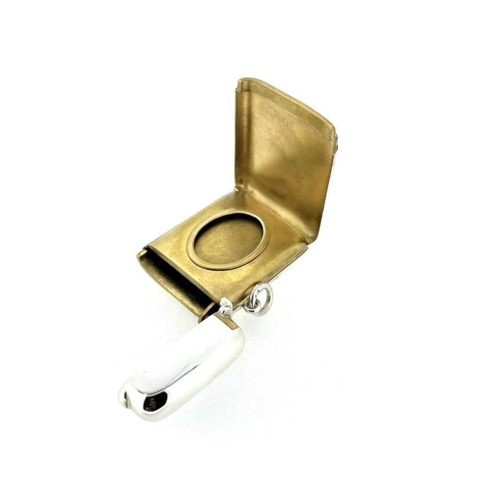 Miniature portrait aperture revealed beneath the concealed silver panel